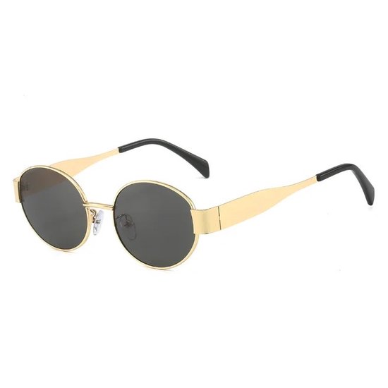 Zonnebril Dames goud - serie 2024 - Festival - Trendy- Triomphe | Gouden Ovale Zonnebril Dames – Zwarte Lenzen – UV400 – Trendy Festival & Vakantiebril